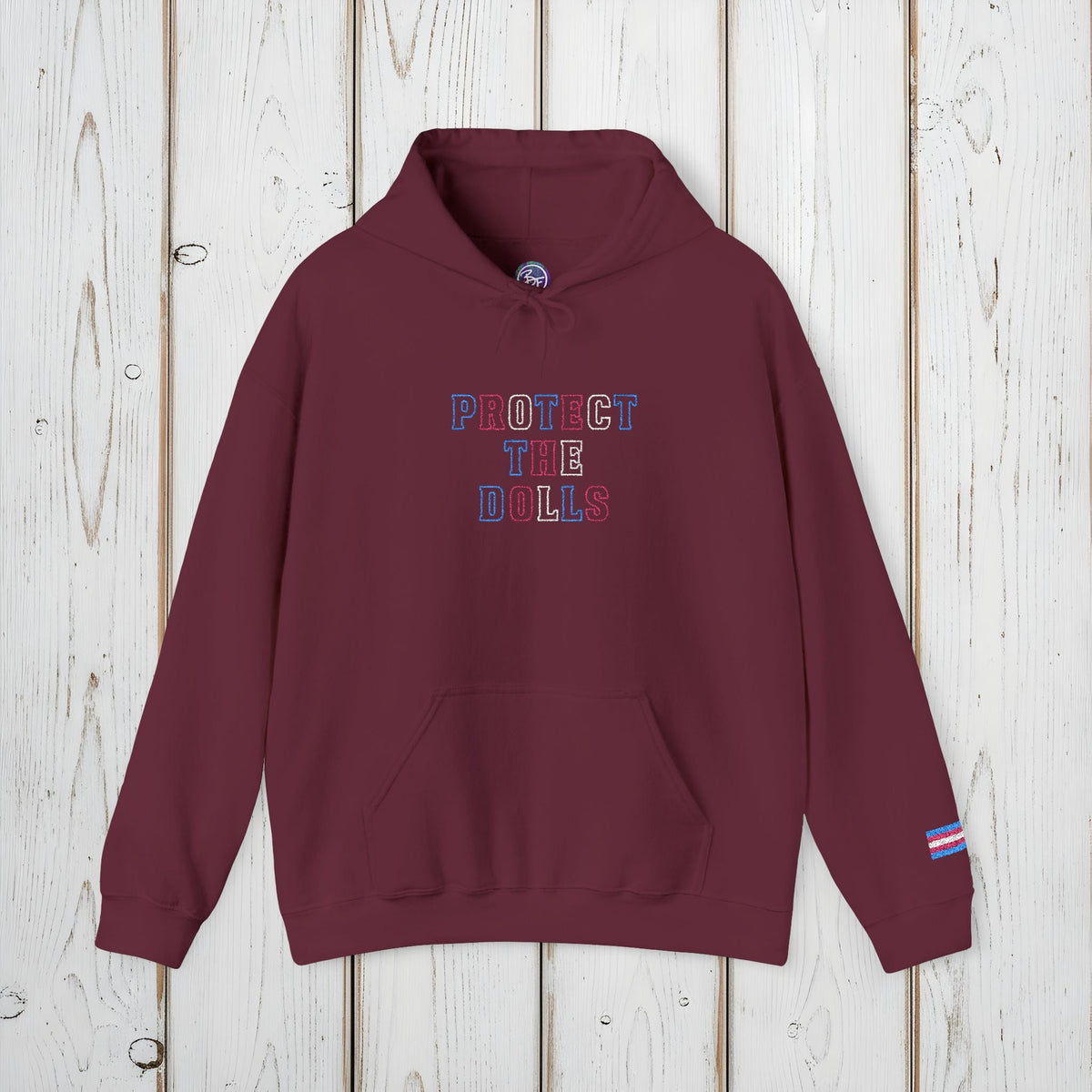 Bespattered Facade Protect the Dolls LGBTQ+ Pride Trans Support Embroidered Unisex Heavy Blend™ Hooded Sweatshirt